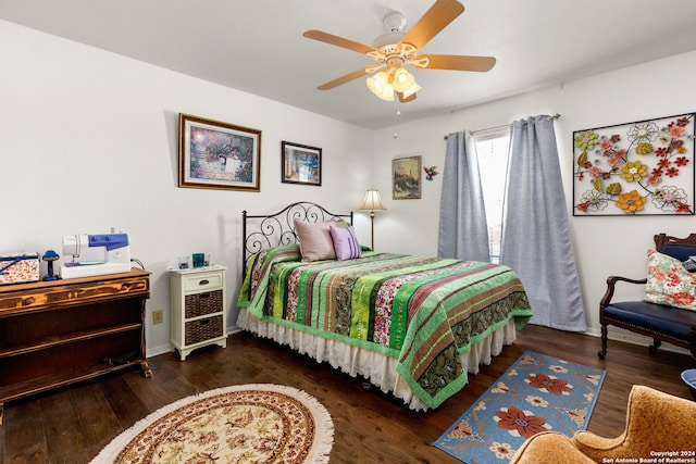 bedroom with ceiling fan and dark hardwood / wood-style flooring