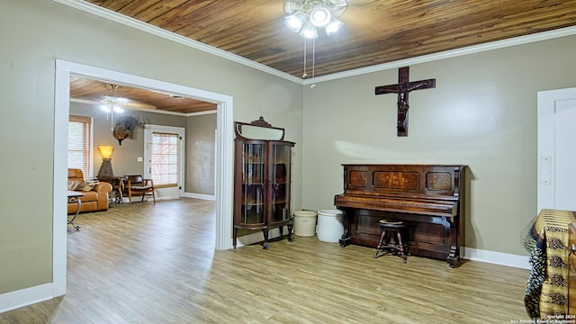 1801 3rd St, Floresville, TX 78114 - sitting room with ceiling fan, wood finished floors, crown molding, baseboards, and wood ceiling