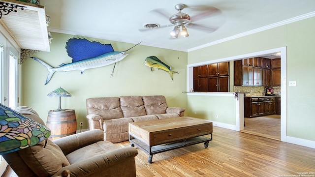 living room with ceiling fan, light hardwood / wood-style flooring, and crown molding