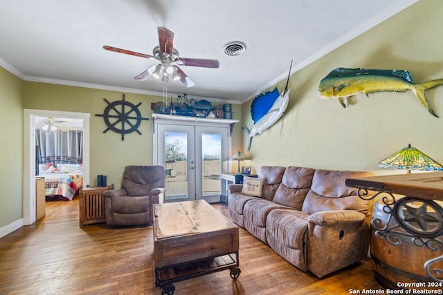 living room with ceiling fan, wood-type flooring, crown molding, and french doors