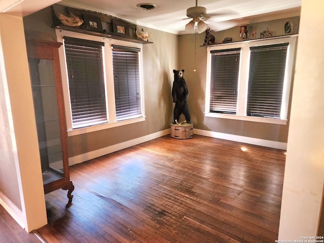 1801 3rd St, Floresville, TX 78114 - spare room featuring a ceiling fan, baseboards, wood-type flooring, and crown molding