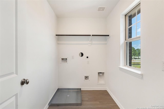 laundry area with washer hookup, hookup for a gas dryer, hookup for an electric dryer, and hardwood / wood-style flooring