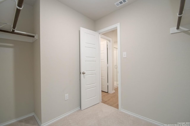 unfurnished bedroom featuring light colored carpet