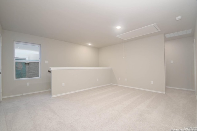 empty room featuring light colored carpet