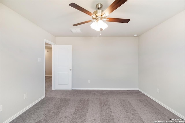 carpeted empty room featuring ceiling fan