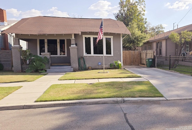 bungalow with a front yard