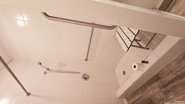 bathroom with tiled shower