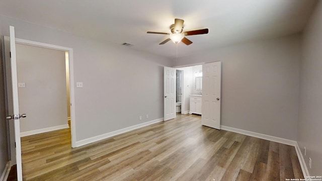 unfurnished bedroom with wood-type flooring and ceiling fan