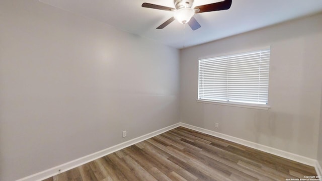 empty room featuring dark hardwood / wood-style floors and ceiling fan