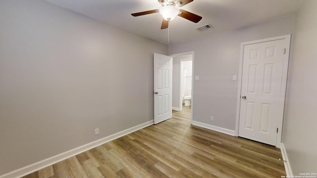 spare room featuring hardwood / wood-style flooring and ceiling fan