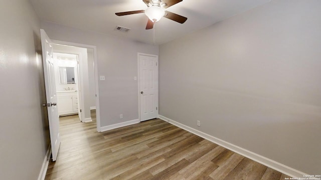 unfurnished bedroom featuring ceiling fan and light hardwood / wood-style flooring