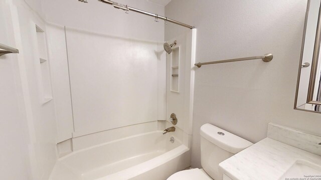 full bathroom with bathtub / shower combination, vanity, and toilet