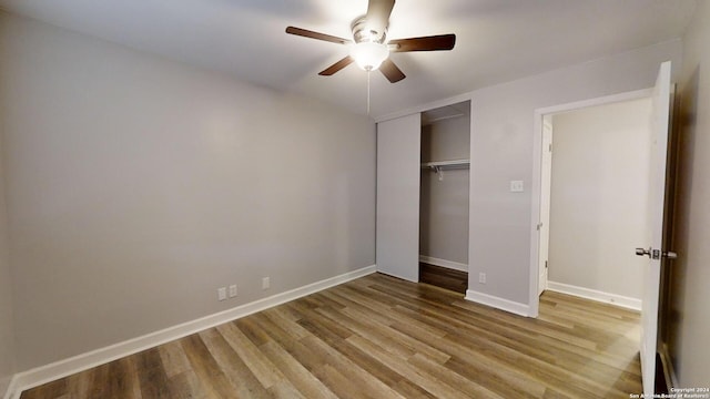 unfurnished bedroom featuring light wood-type flooring, ceiling fan, and a closet