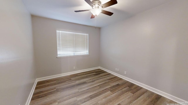 unfurnished room with ceiling fan and hardwood / wood-style floors