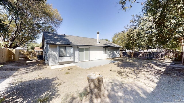 rear view of property featuring a patio