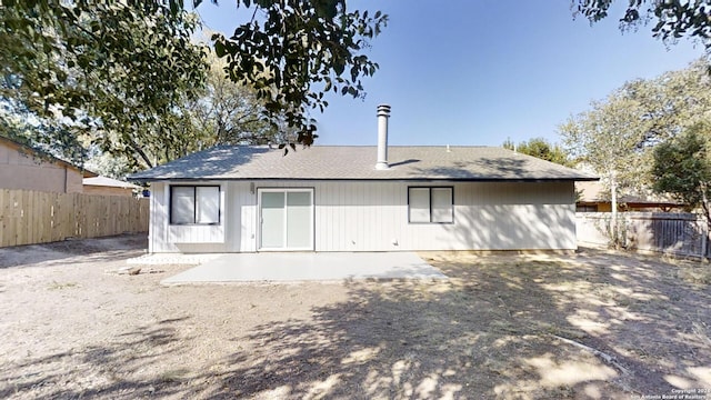 rear view of property featuring a patio