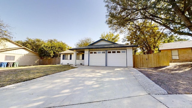 ranch-style home with a garage