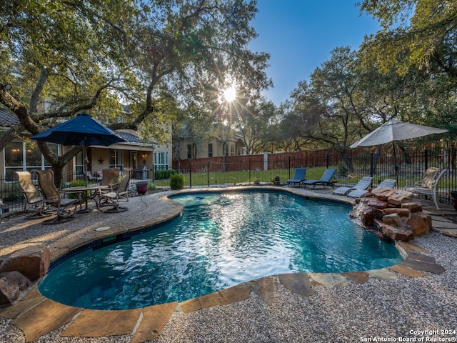 view of swimming pool with a patio