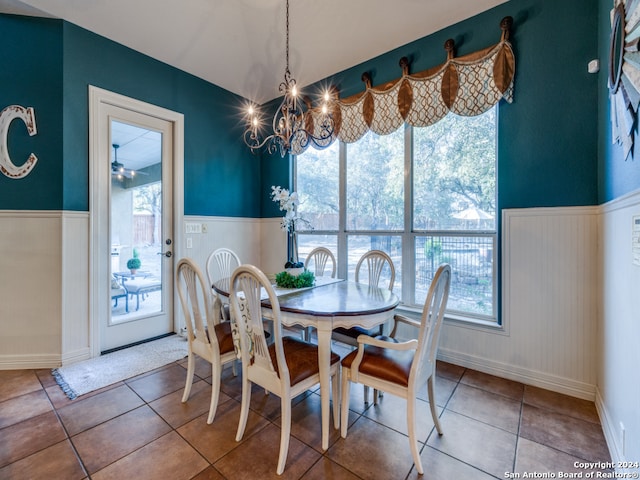 dining room featuring tile patterned floors and a notable chandelier