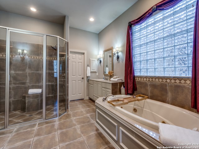 bathroom with vanity, plus walk in shower, and tile patterned flooring