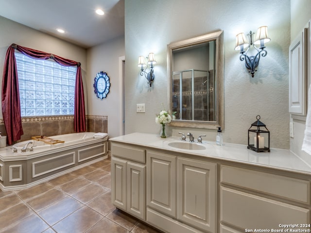 bathroom with vanity, tile patterned floors, and separate shower and tub