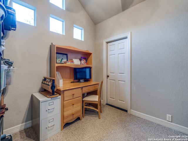 office with light carpet, a healthy amount of sunlight, and vaulted ceiling