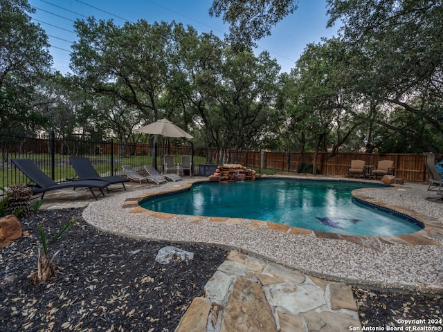 view of swimming pool with a patio area