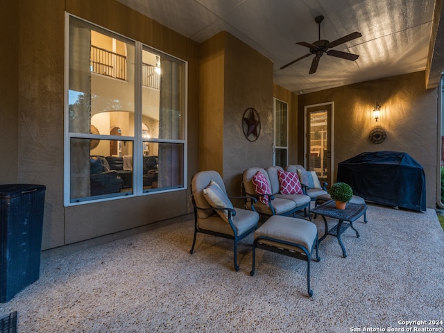 view of patio with area for grilling and ceiling fan