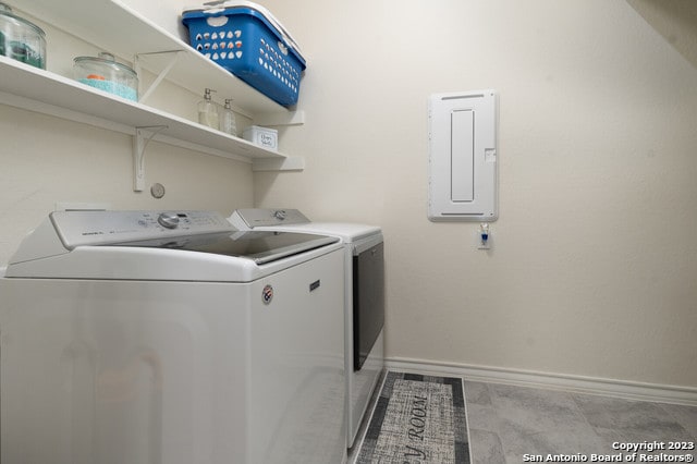 washroom featuring electric panel and independent washer and dryer