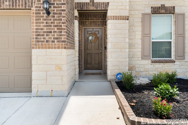 property entrance with a garage