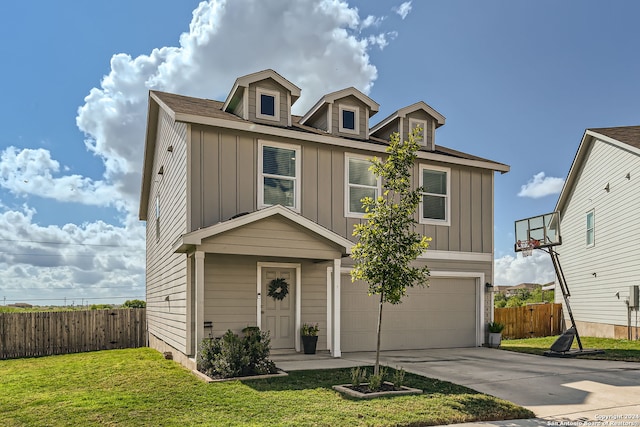 view of front of home with a garage and a front lawn