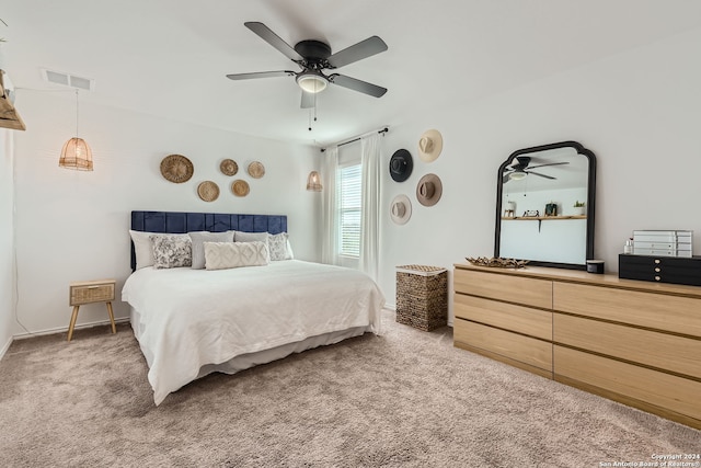 bedroom with ceiling fan and carpet floors