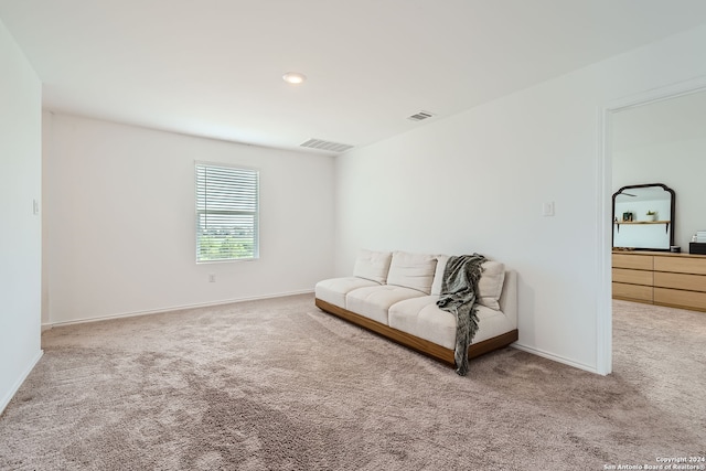 living area featuring carpet flooring