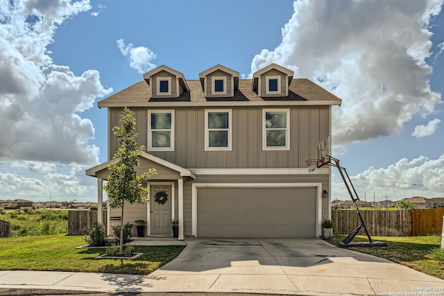 view of front of home featuring a front lawn and a garage