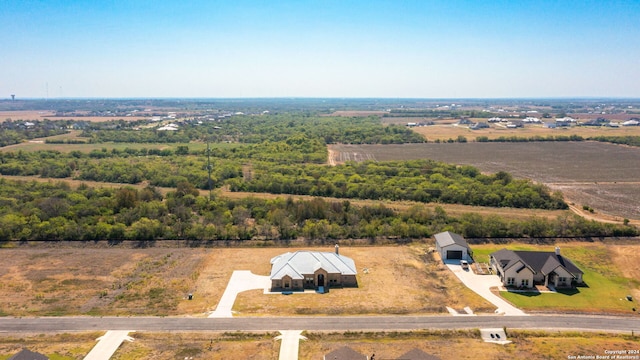 birds eye view of property with a rural view