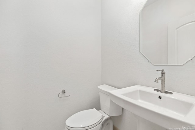 bathroom with sink and toilet