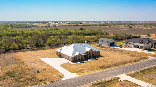 birds eye view of property featuring a rural view