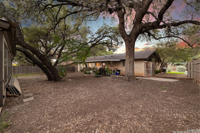 view of yard at dusk