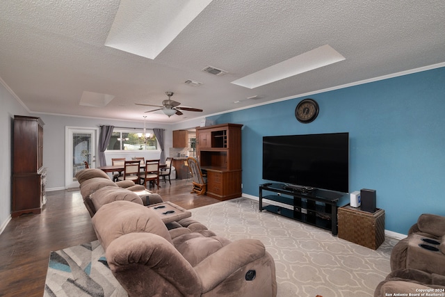 living room featuring ornamental molding, ceiling fan, light hardwood / wood-style floors, and a textured ceiling