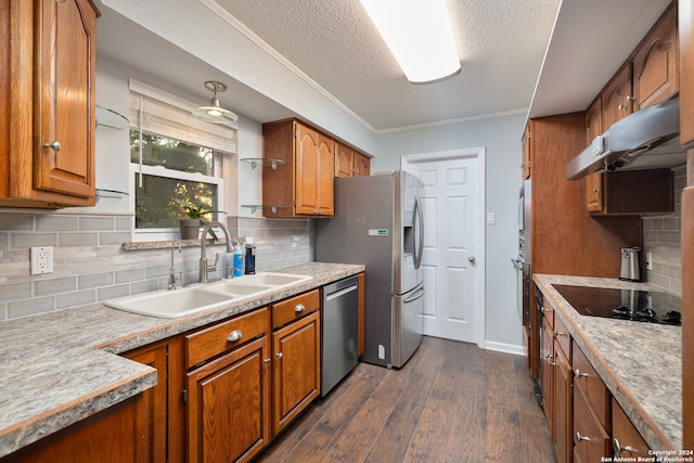 kitchen with ornamental molding, sink, appliances with stainless steel finishes, dark hardwood / wood-style floors, and decorative backsplash