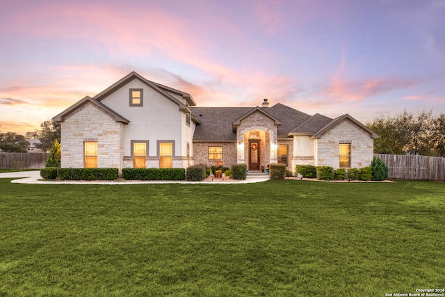 view of front of home with a lawn