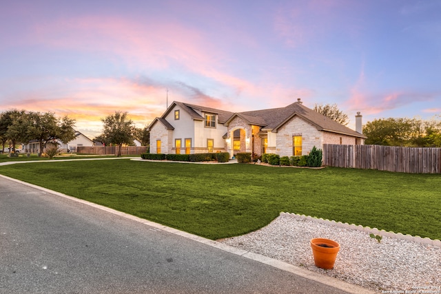 view of front of house with a lawn