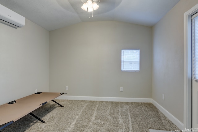 unfurnished office featuring ceiling fan, lofted ceiling, carpet, and an AC wall unit