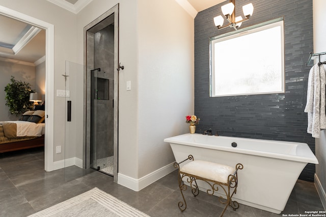 bathroom with crown molding, tile walls, a chandelier, and independent shower and bath