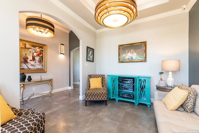 living area featuring a notable chandelier and ornamental molding