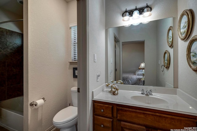 full bathroom featuring  shower combination, vanity, and toilet