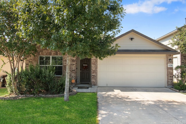 view of front of house with a garage and a front yard