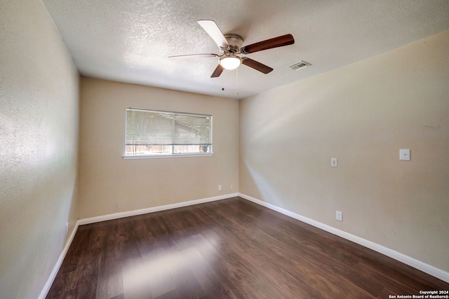 8315 Greenham, San Antonio, TX 78239 - empty room with dark wood-type flooring, ceiling fan, a textured ceiling, and baseboards