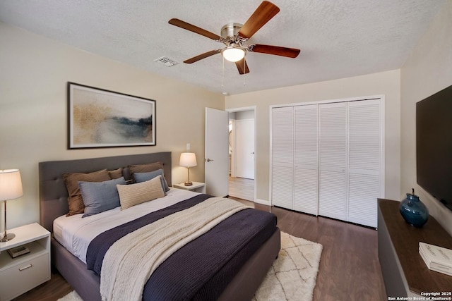 8315 Greenham, San Antonio, TX 78239 - bedroom with dark wood-type flooring, a closet, ceiling fan, and a textured ceiling