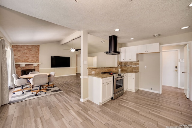 kitchen featuring lofted ceiling with beams, exhaust hood, white cabinets, light hardwood / wood-style flooring, and stainless steel electric range